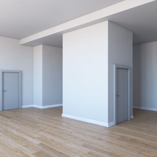 Empty room with parquet floor.